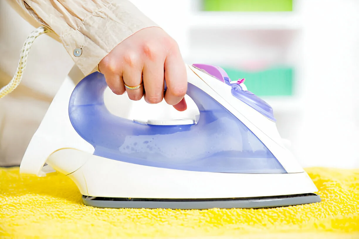 https://www.istockphoto.com/photo/person-ironing-clothes-gm486205359-38270754
