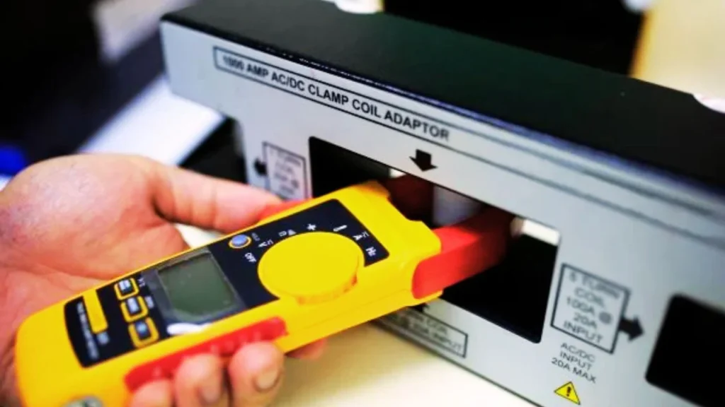 How does a clamp meter work and what are its uses?